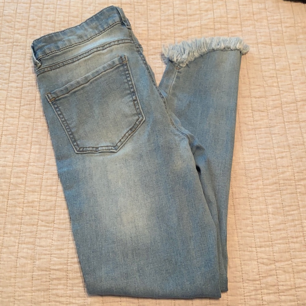 Refuge brand light wash jeans with fringe ankle